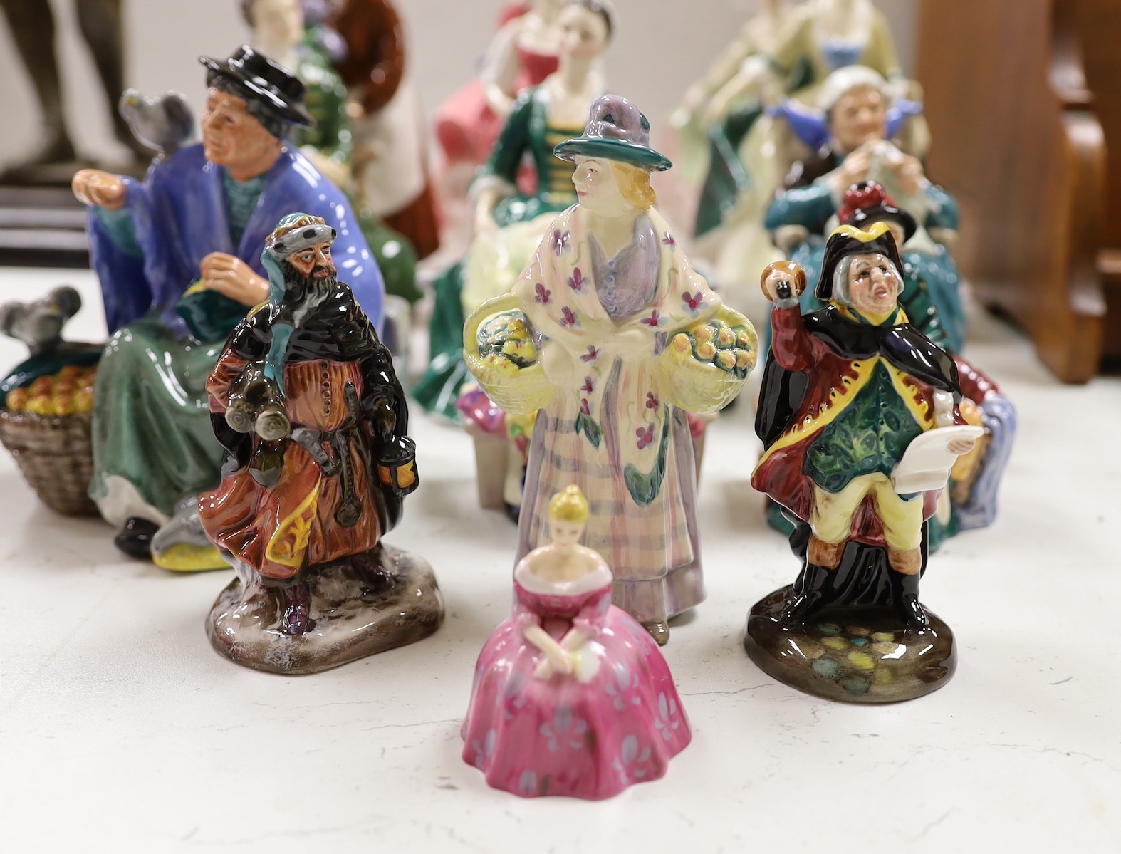 Fifteen Royal Doulton figures of varying heights, tallest Top O the hill 19cms high